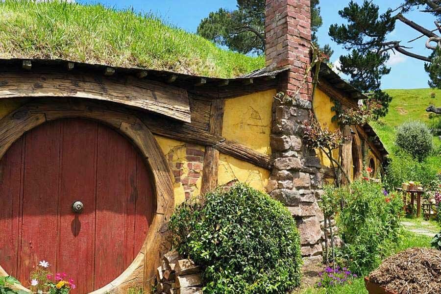 Circular front door of a Hobbit house from the set of the movie Lord of the Rings. 