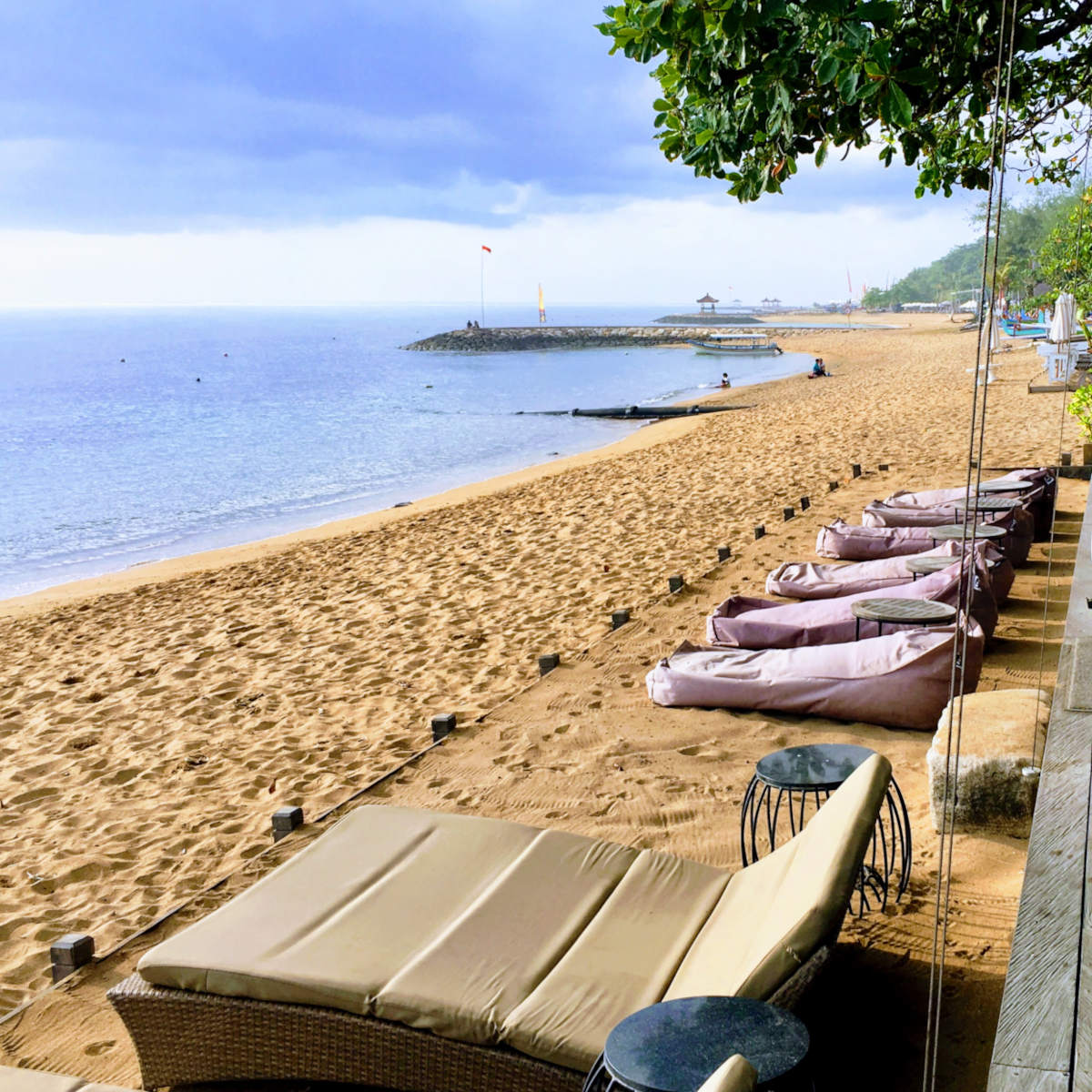 Bean bags and chairs on the beach in Sanur, Bali.
