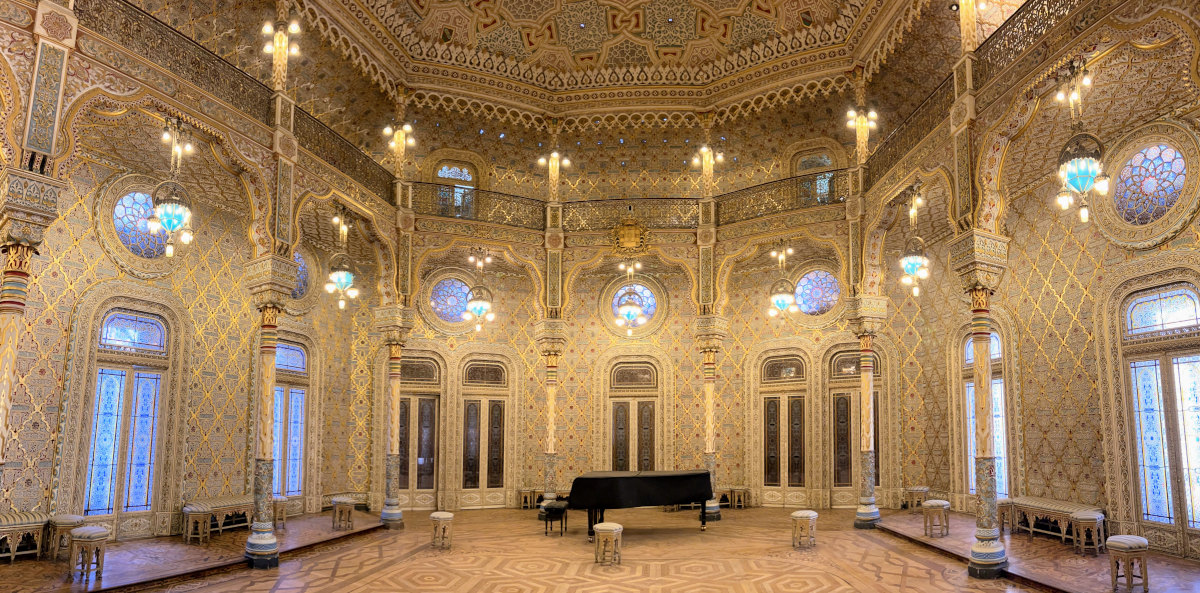 Exquisitely ornate and opulent gold interior ballroom in Arabian style.